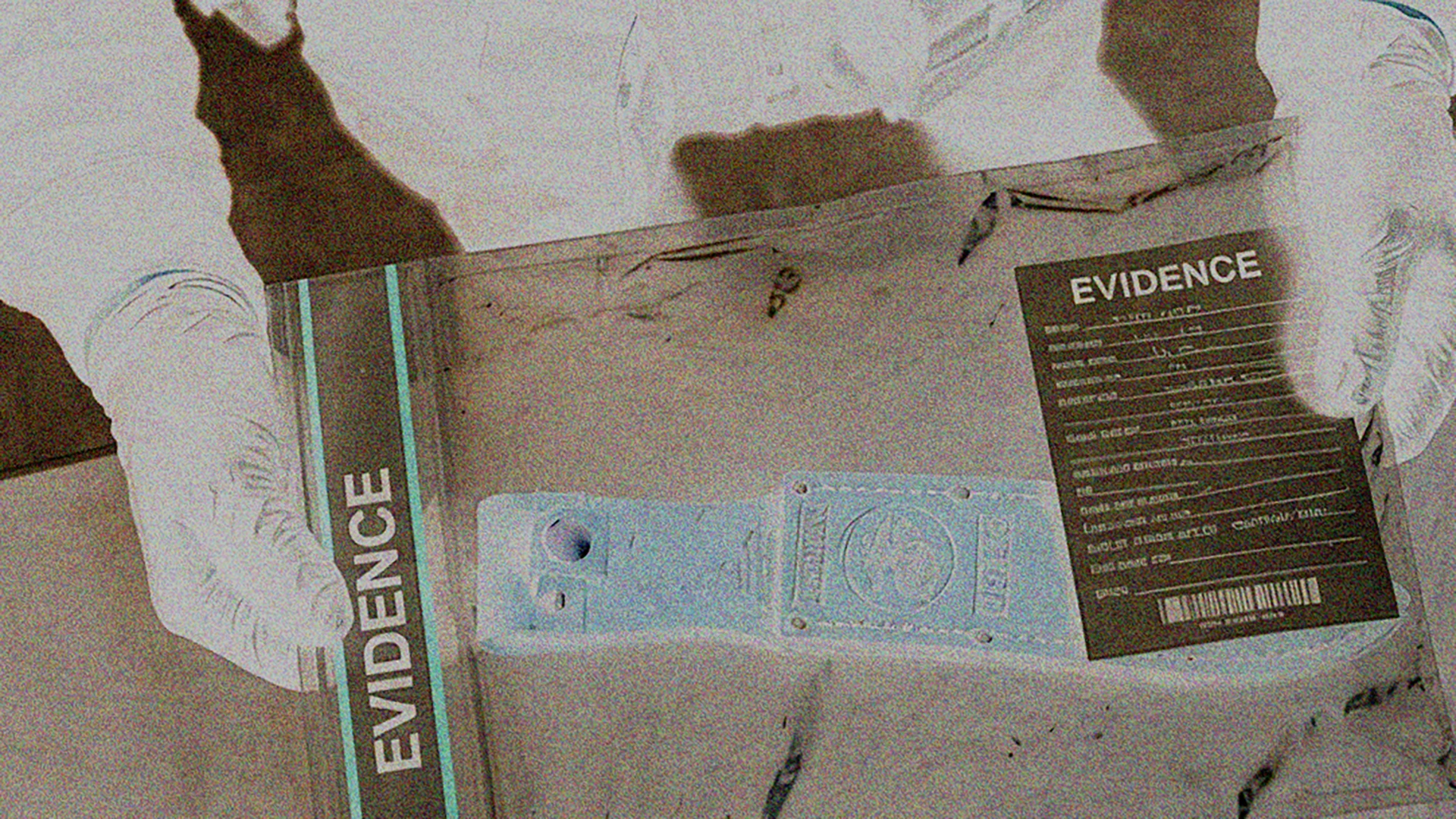 Tagged evidence bag held by a gloved technician
